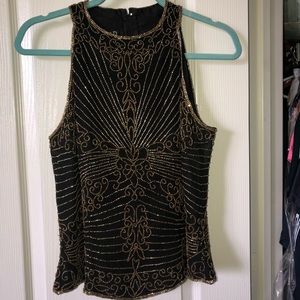 Beaded black top.  Size L .